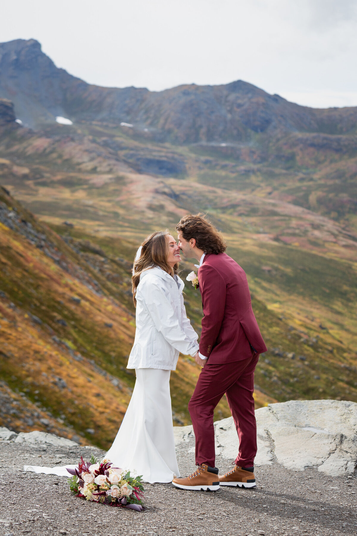 A bride and groom kiss.