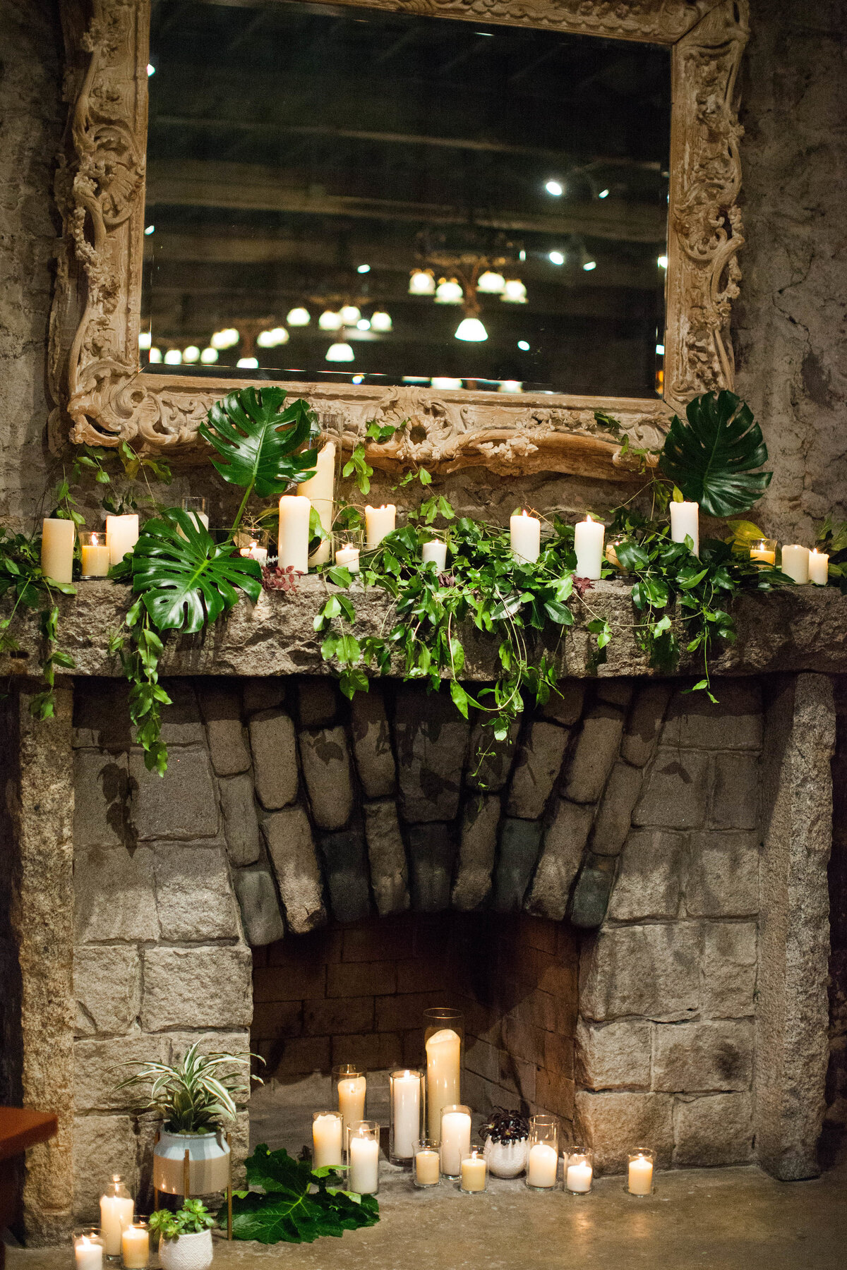 fire place with greenery and candles