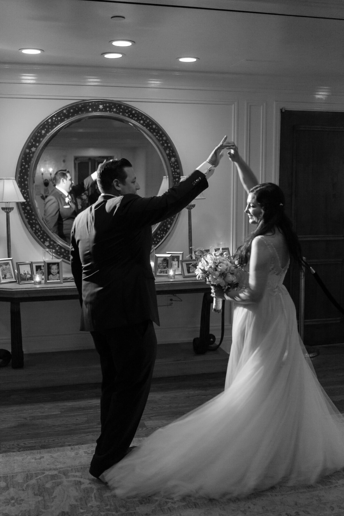 A bride and groom dancing together