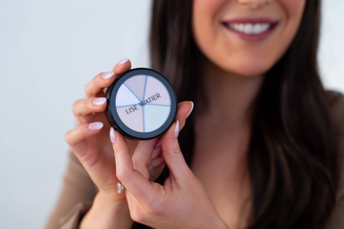 Ottawa brand photos of a Lise Watier eyeshadow compact held by Stephanie Bullock makeup artist.  Captured during a branding session with JEMMAN Photographry COMMERCIAL
