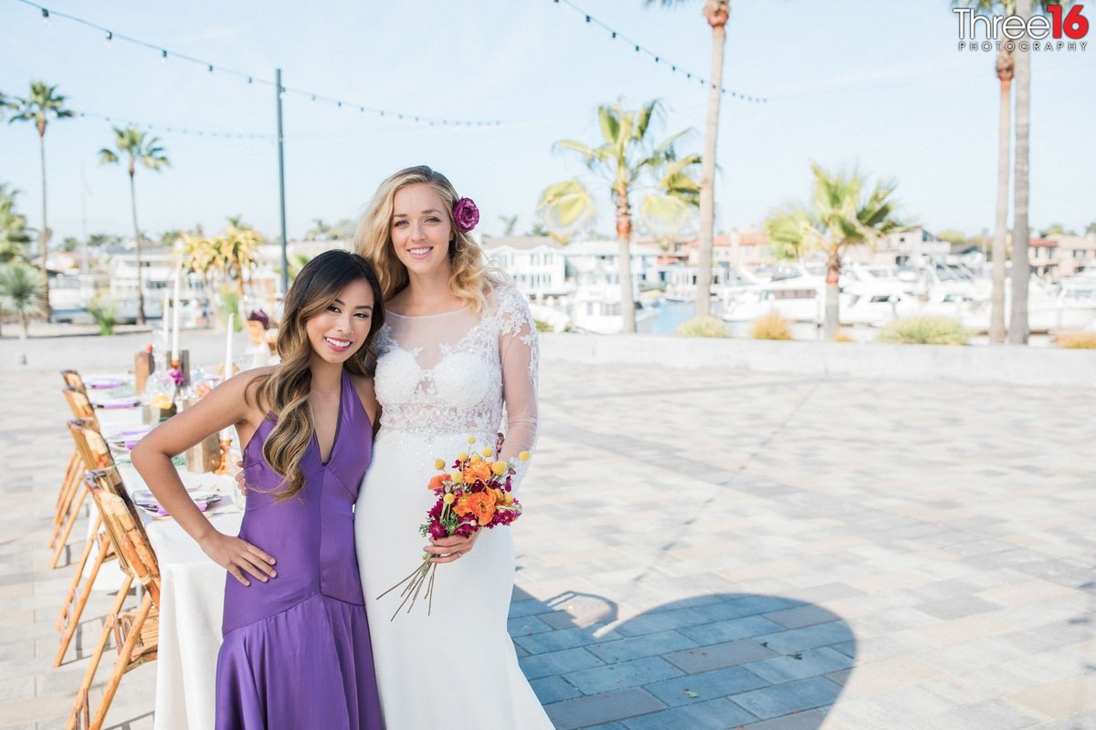 Bride poses with her Maid of Honor