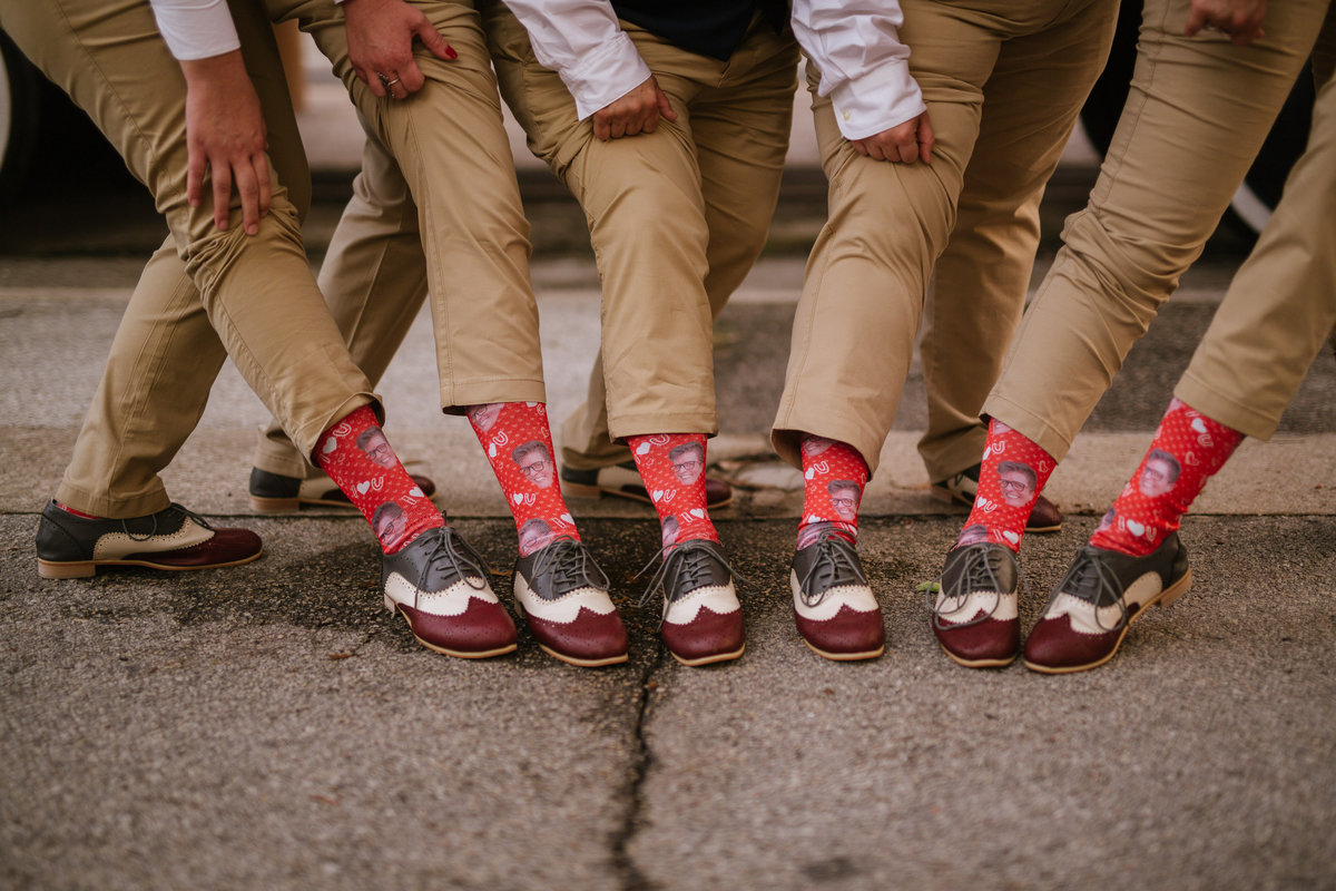 bridal party groomsmen and bridesmaid wedding gag gift of socks from divvy up at Historic Sunset Station Wedding downtown