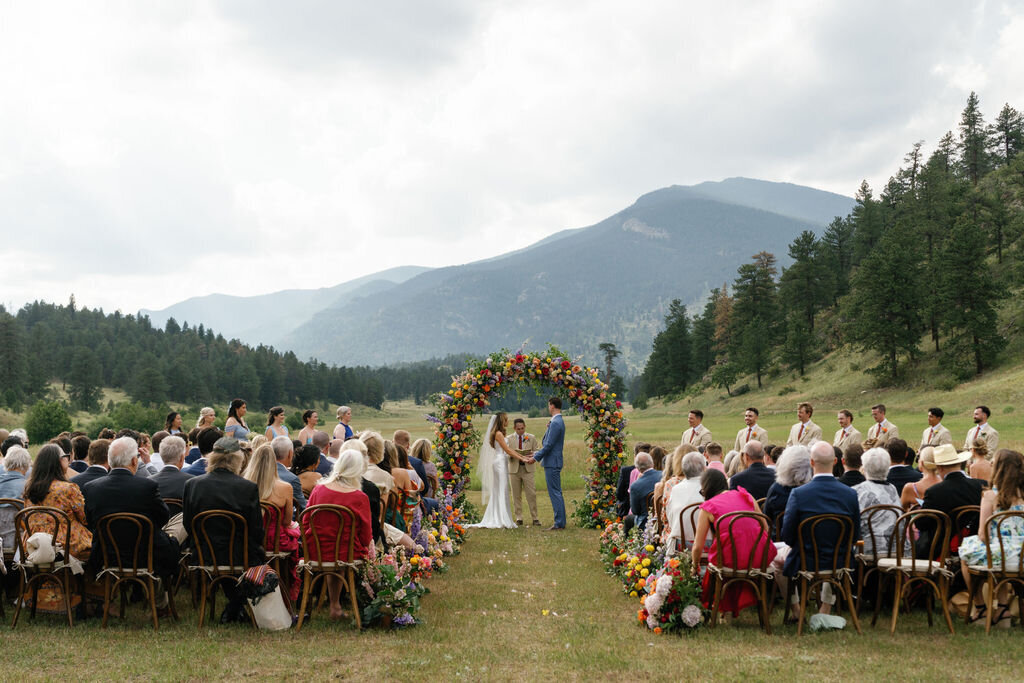 Colorado-wedding-planner-outdoor-ceremony-colorful-arch