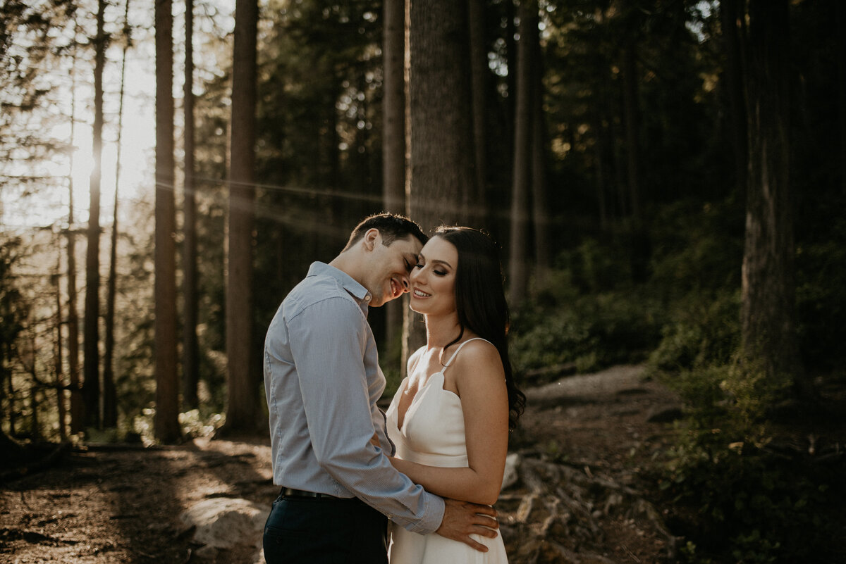 engaged couple at white pine beach in the forest