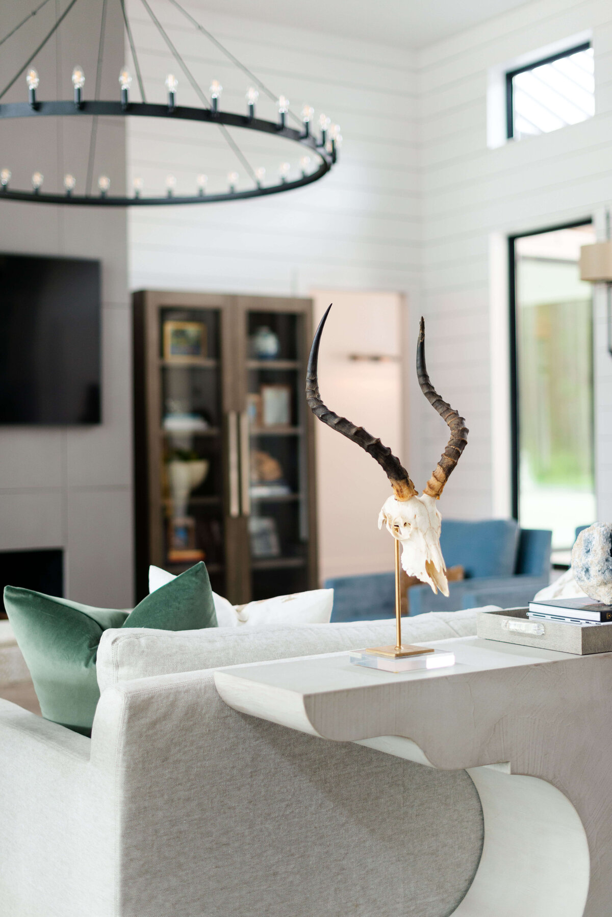 oyster creek studios building belt new build skull sculpture on white marble side table in living room
