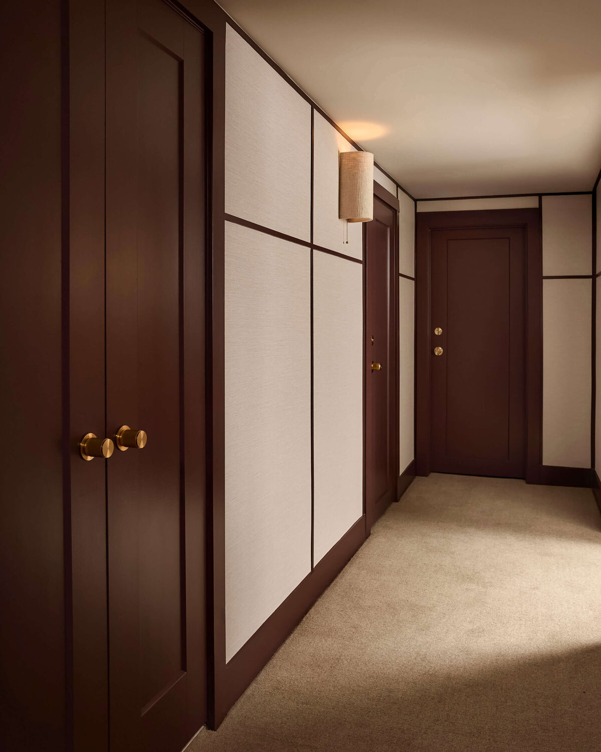 burgundy-trim-hallway-brass-hardware-wilmington-interior-designer