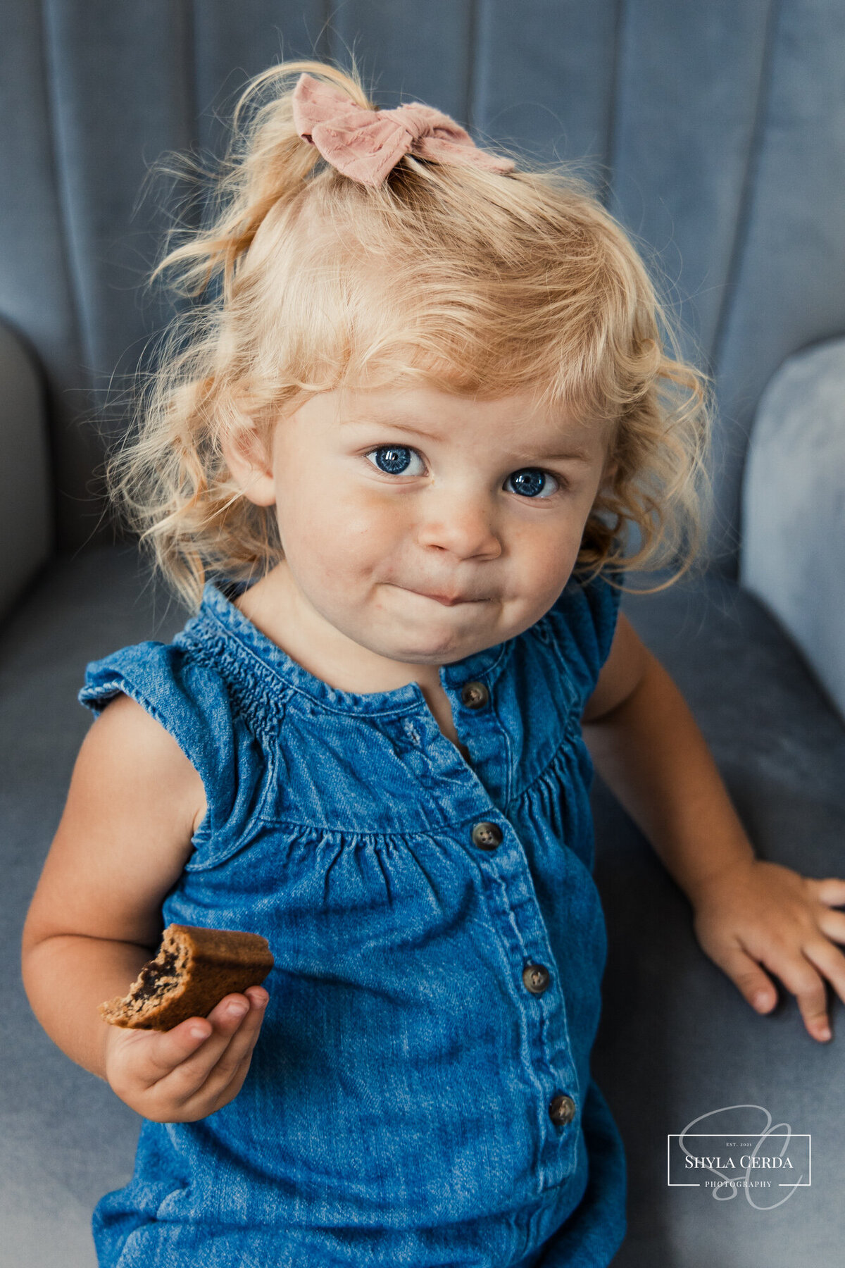 Baby girl eating snack during studio session