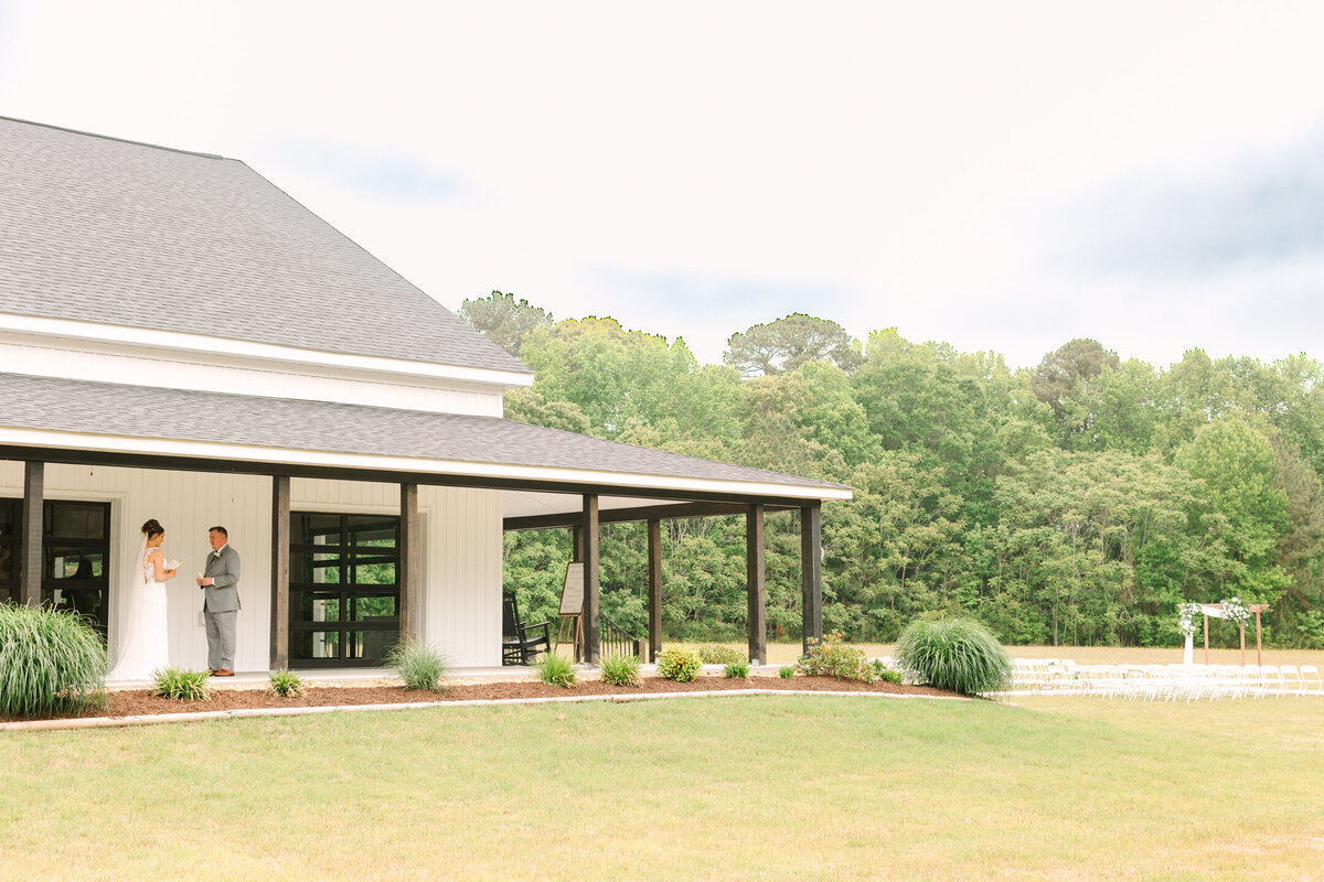 Bride and groom read private vows during their first look at New Branch Farms