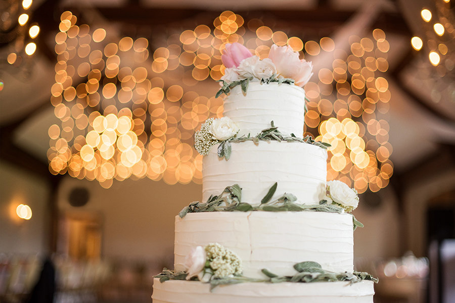 Beautiful wedding cake with lights in the background at Silver Creek Country Club in PA