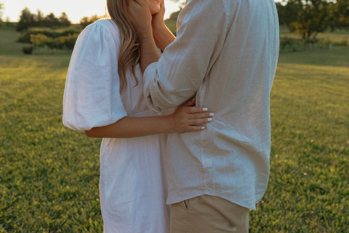 Sunlit picnic moment during a couples session in a vibrant tropical winery setting

