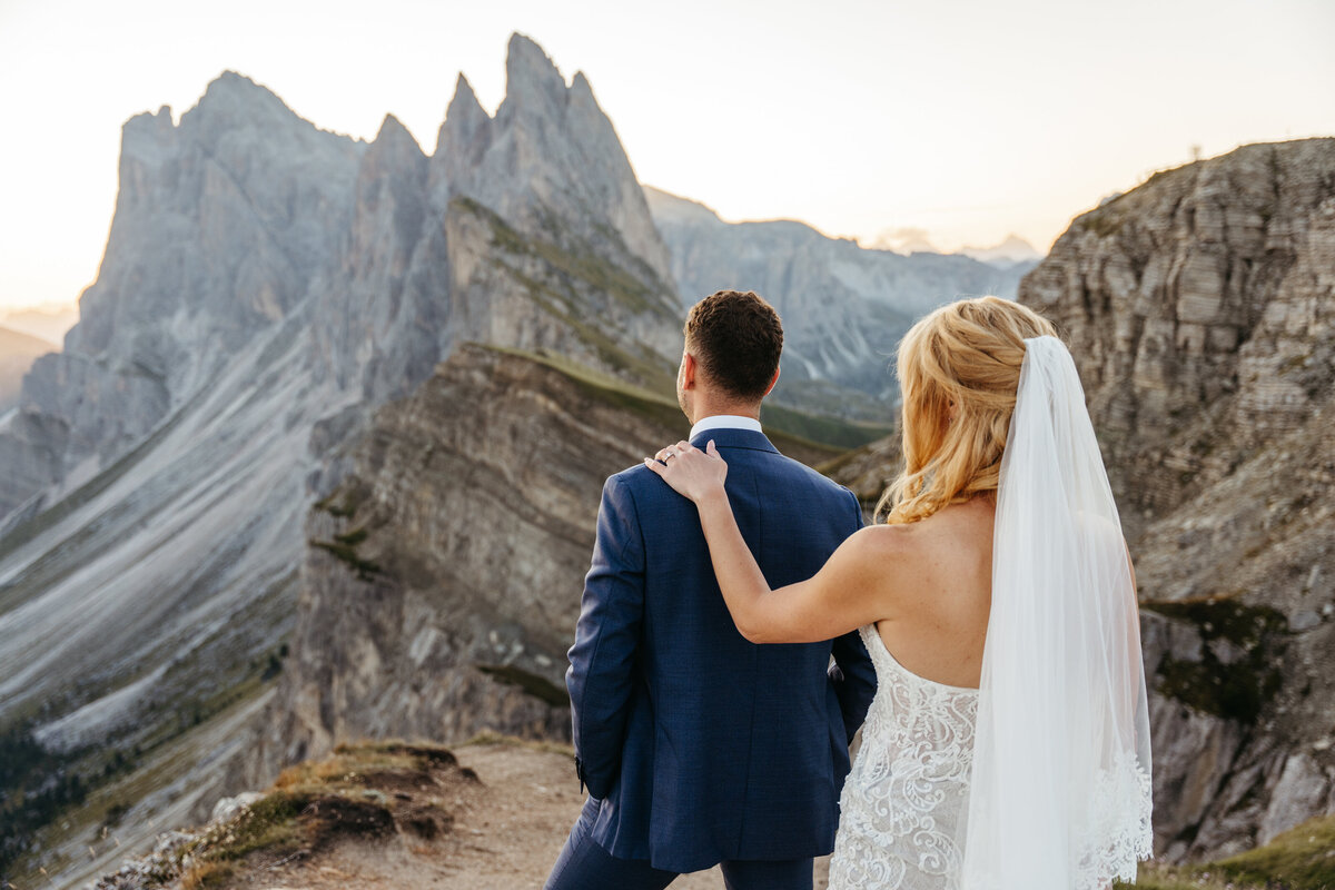 Bride and groom first look at sunrise on Seceda ridge