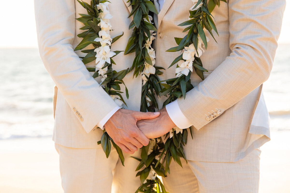 holding hands during wedding photos in Maui, Hawaii
