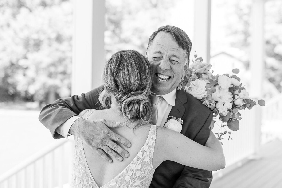 dad and daughter hugging