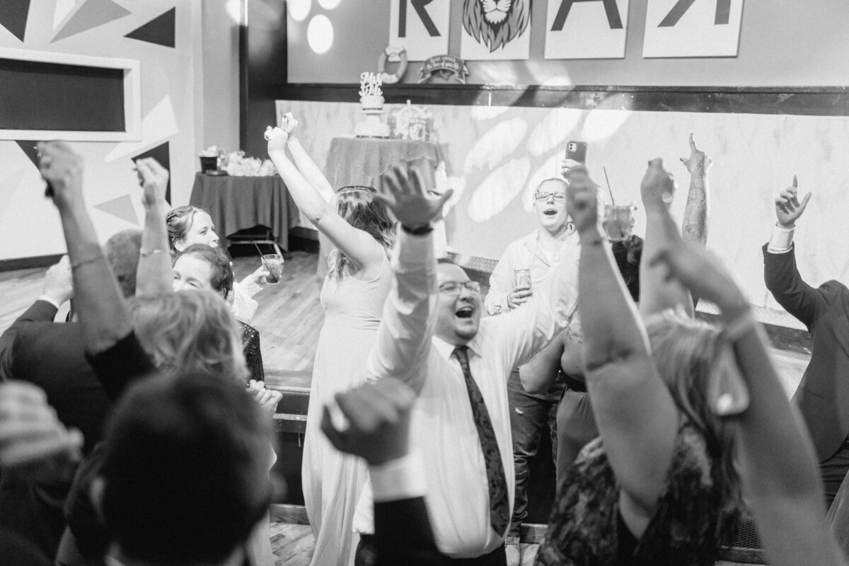Couple celebrating their wedding reception at ROAR in Rochester