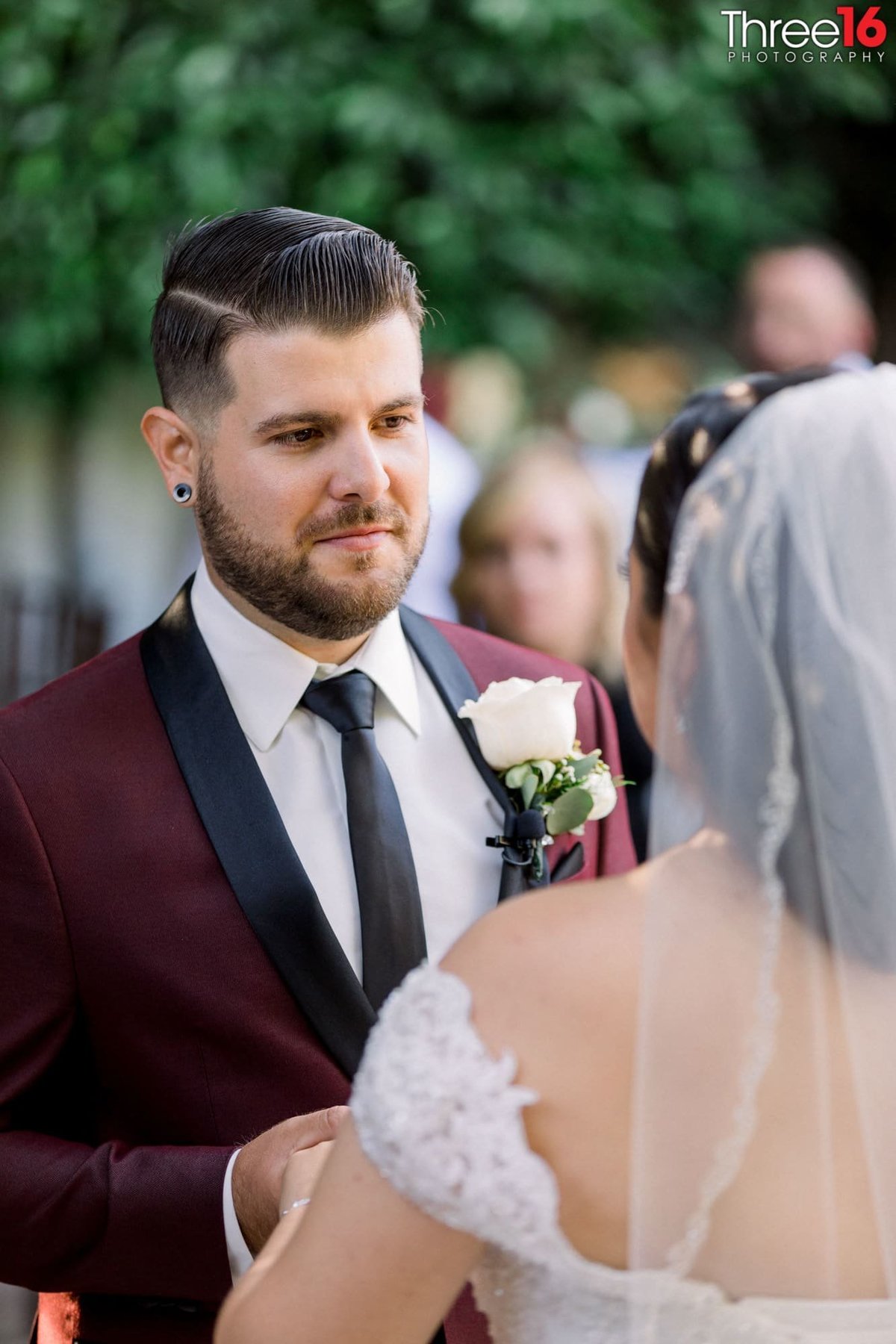Groom makes eyes at his Bride during the wedding ceremony