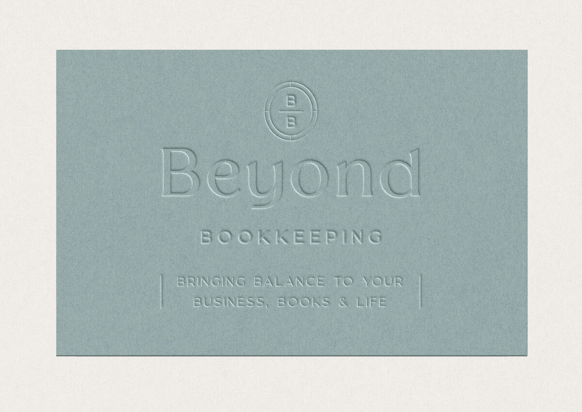 Branded business card with embossed primary logo