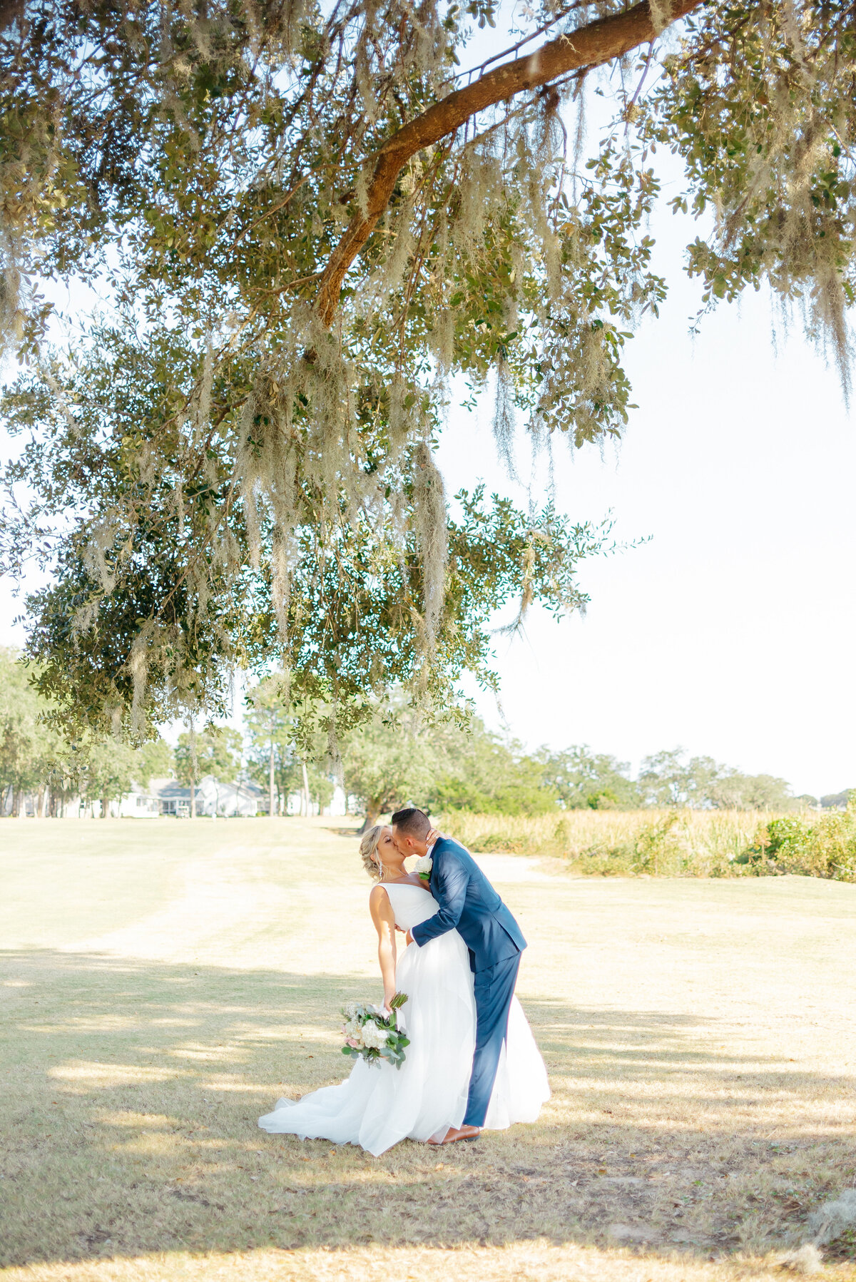 couple kissing under a tree in wilmington, nc