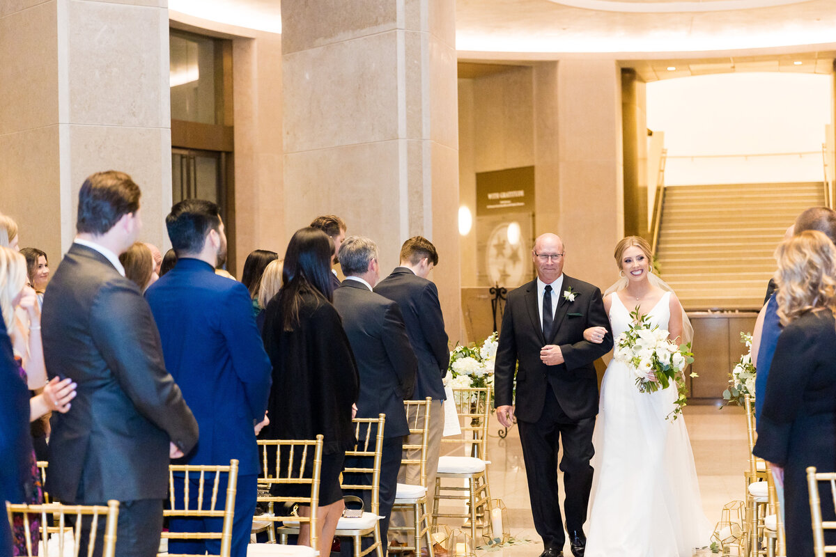 Bride walking down the aisle with father at Tennessee State Museum
