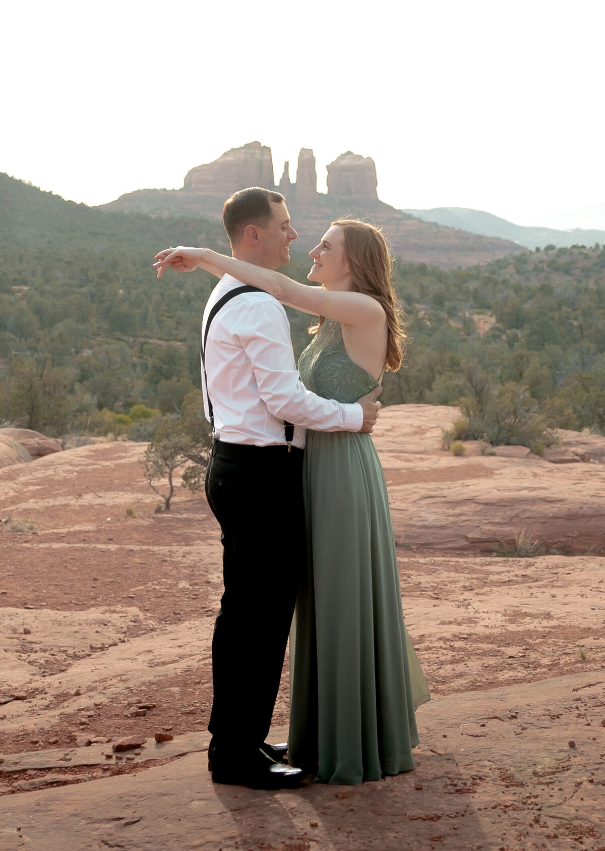 Sunset engagement photo in Sedona with golden Arizona light