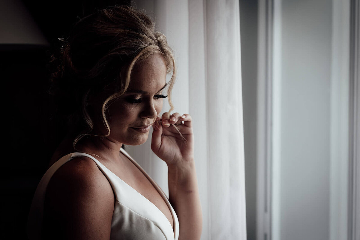 a bridal portrait of an emotional bride deep in thought