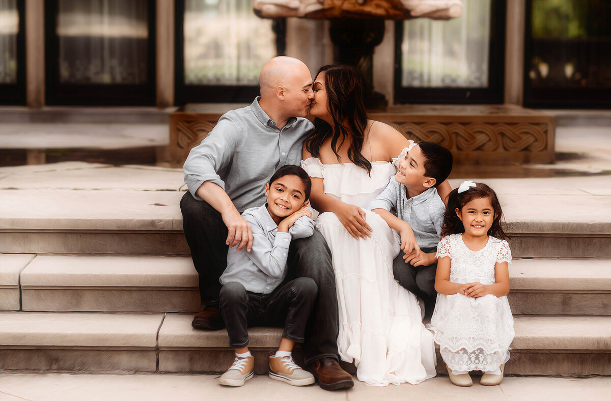 Family embraces each other during Family Photos at Biltmore Estate in Asheville, NC.