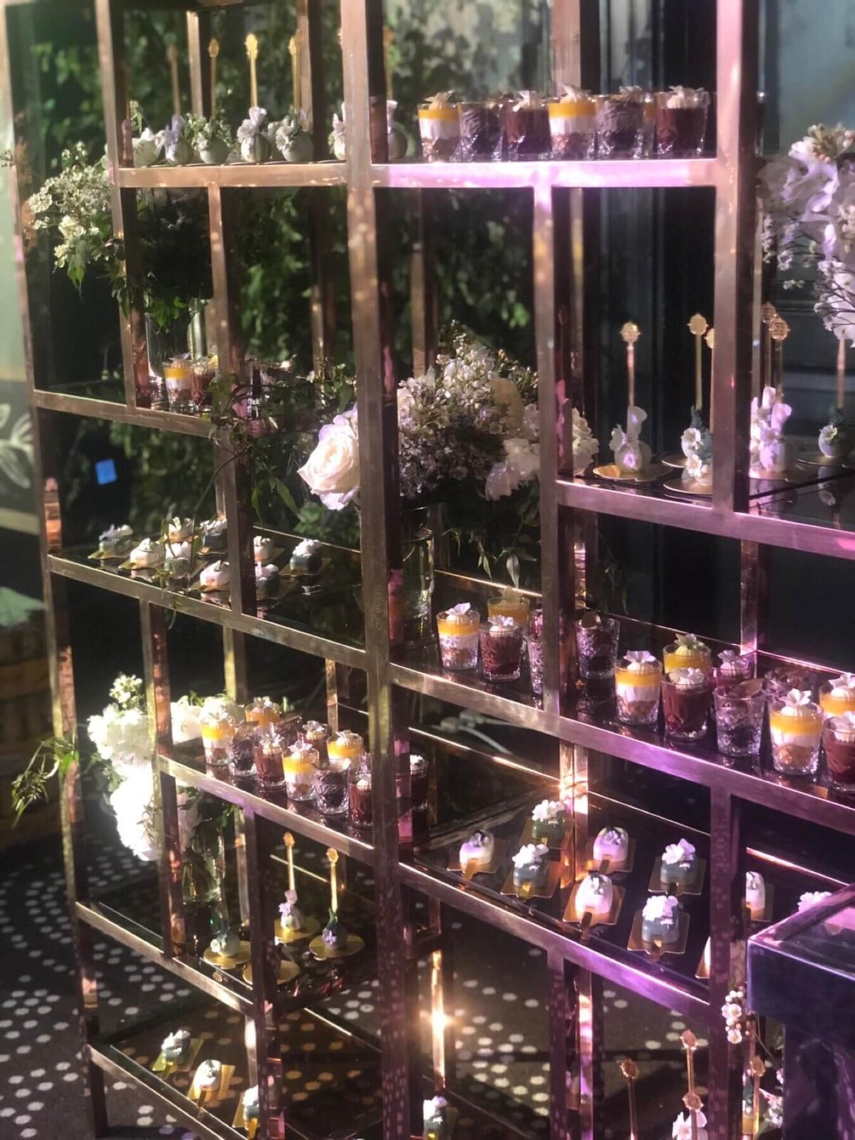 luxury  dessert shelf with floral decorations