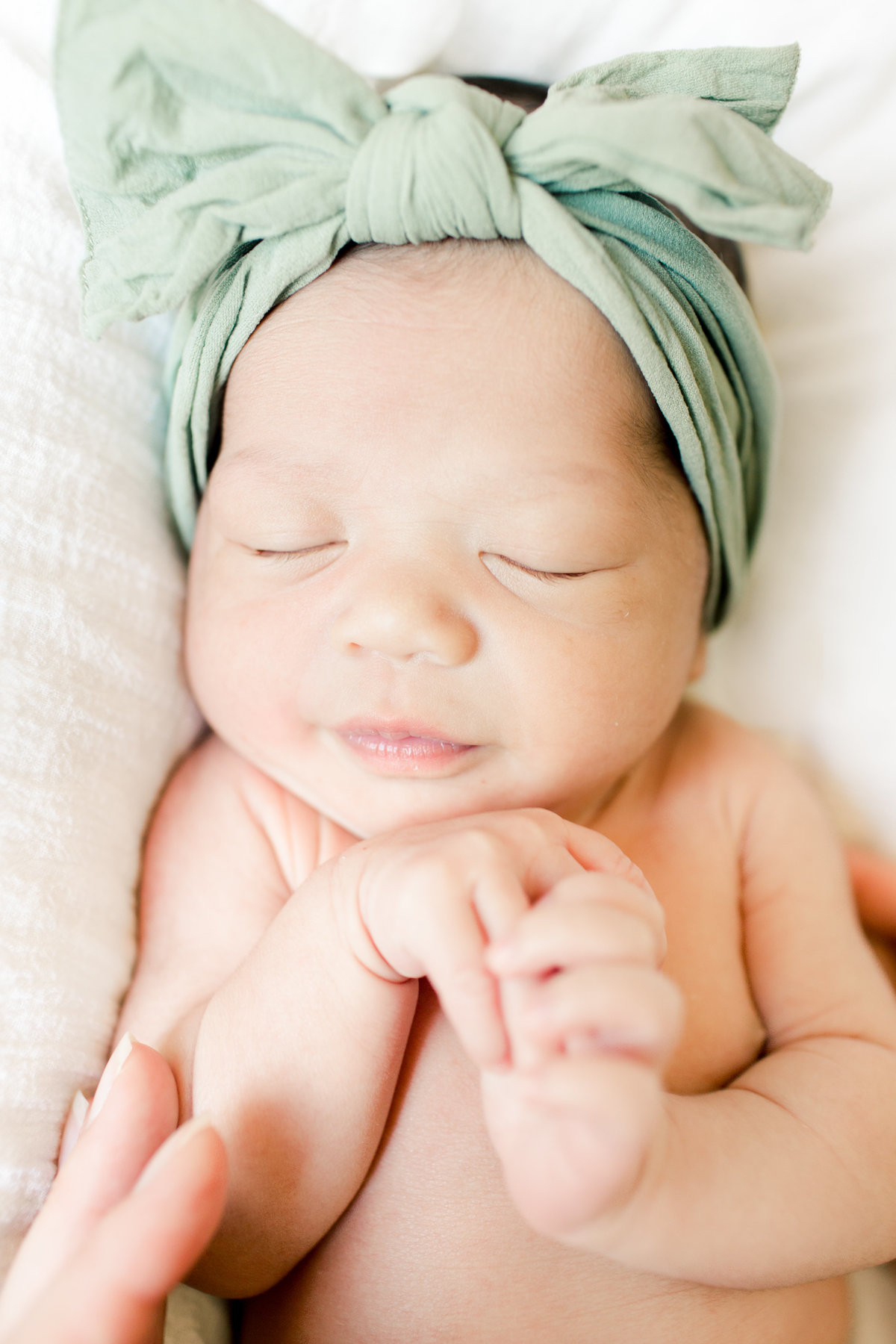 sleeping baby girl for newborn portraits in rochester minnesota