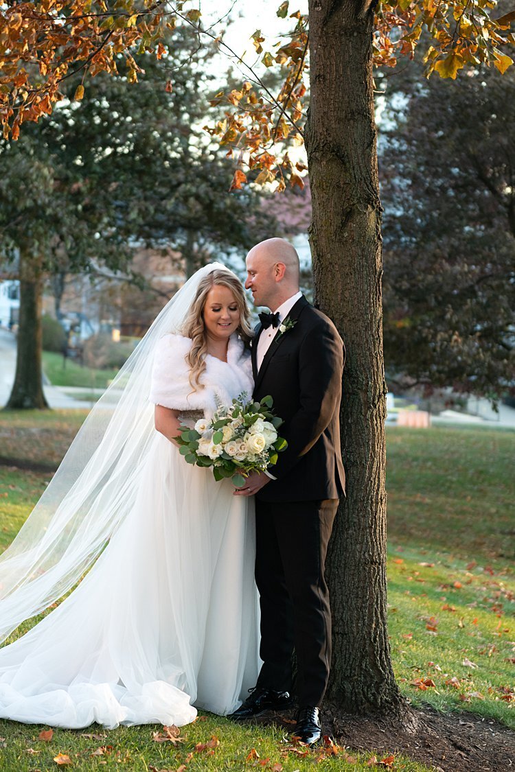 Bride and Groom leaning on tree at Washington and Jefferson University Campus in Beaver, PA