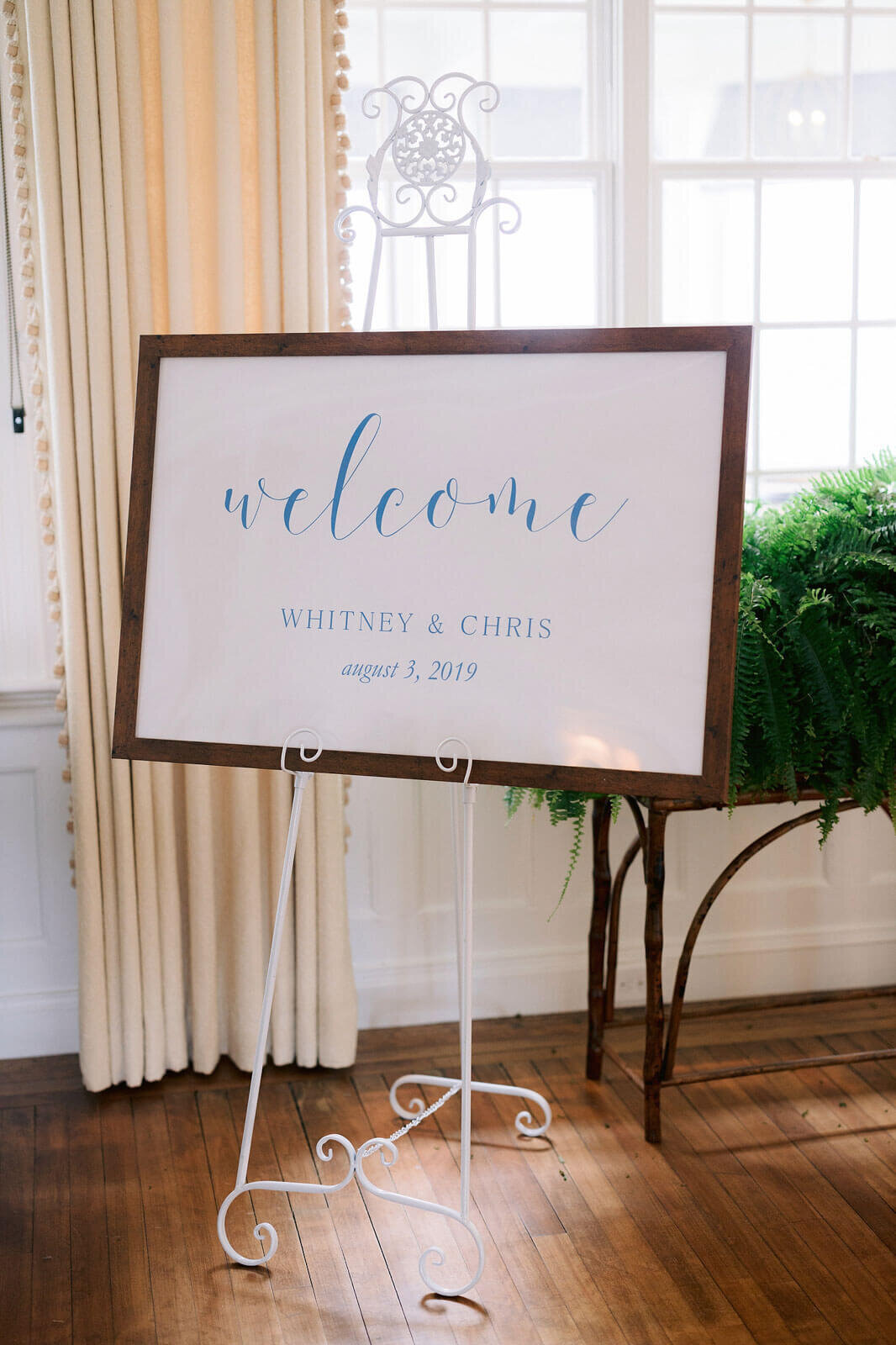 A whiteboard for the bride and groom, with the words: "Welcome Whitney and Chris august 3, 2019" in Wianno Club, Cape Cod, MA.