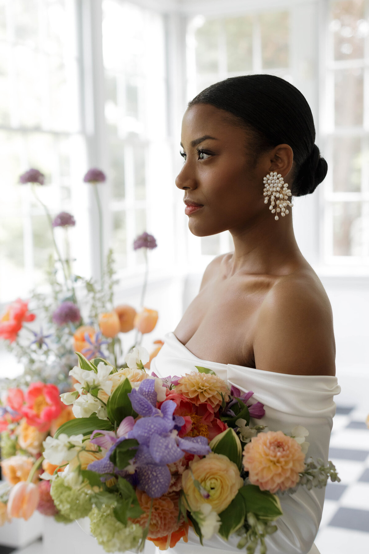 Documentary wedding photography showcasing an intimate portrait of a bride with luxury floral styling, exuding sophisticated elegance.