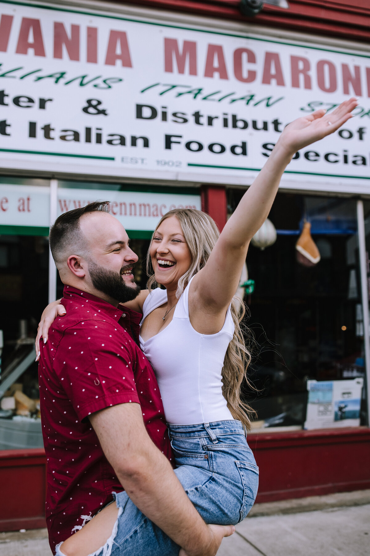 Engaged couple in the strip district of Pittsburgh. 