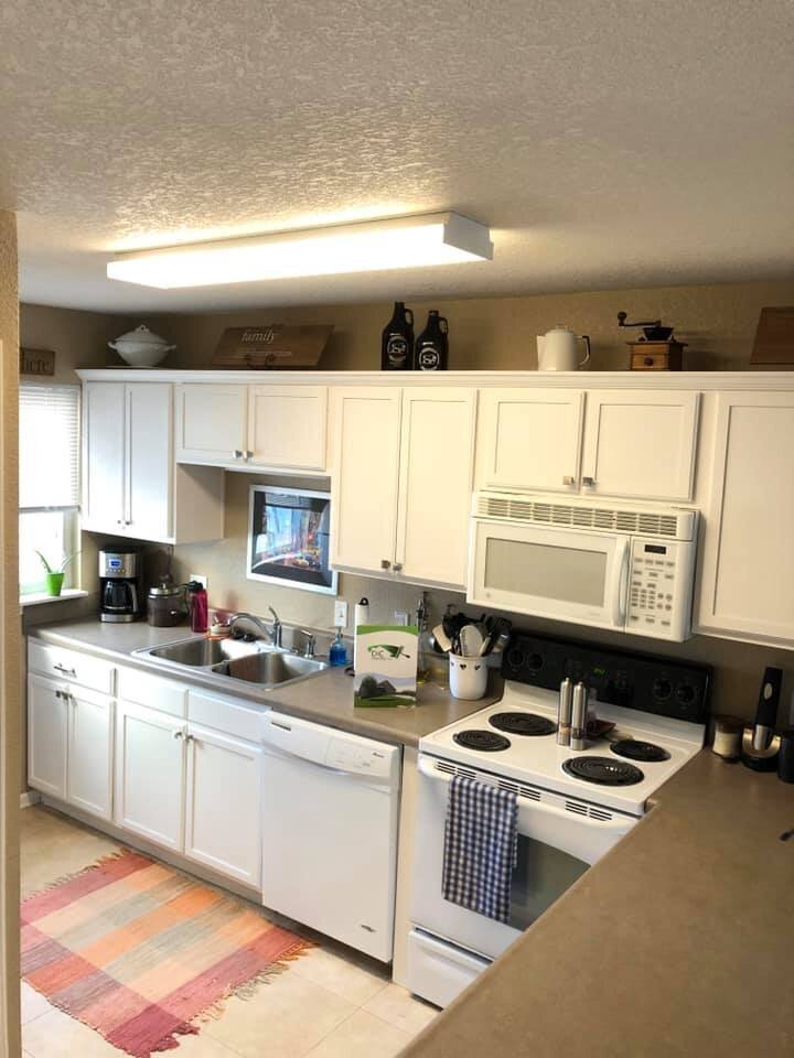 White kitchen with dark countertops