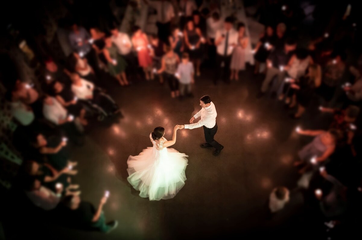 A bride and groom hug after their wedding ceremony captured in by wedding photographer.