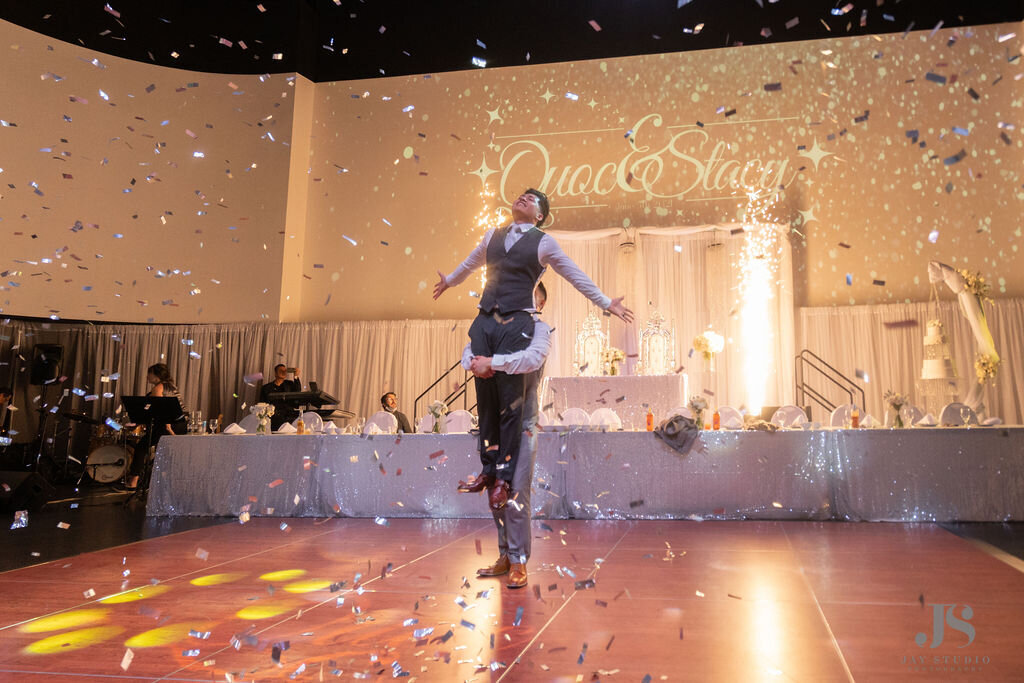 Groom performs a dance for his bride at their reception.