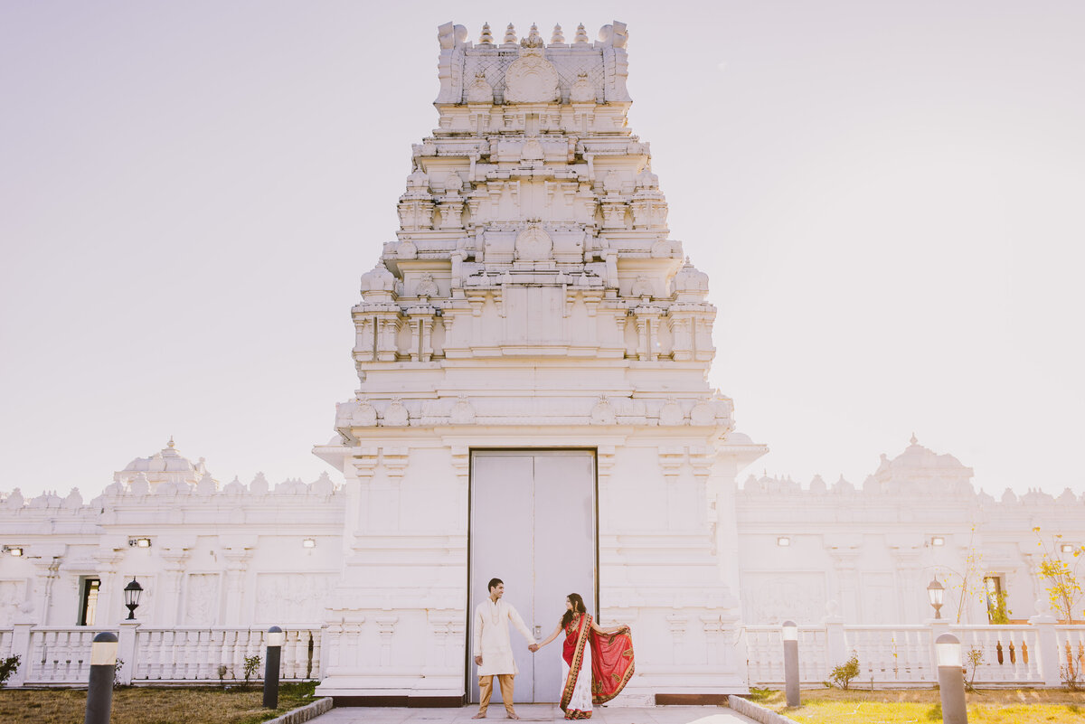 A couple standing at the entrance of the balaji sri venkateswara hindu temple in bridgewater nj