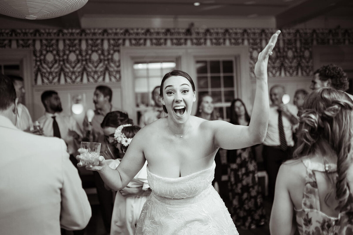 Bride laughing on the dance floor