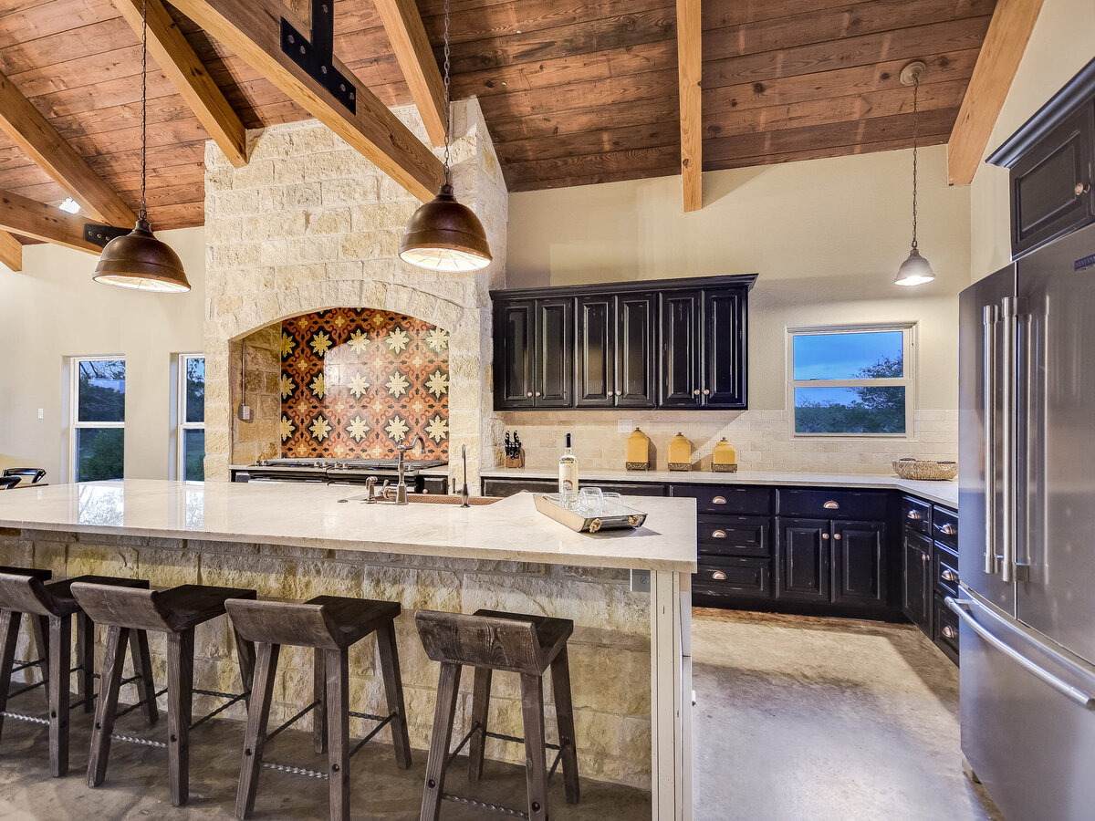 Wooden and beige coloured kitchen  with large island