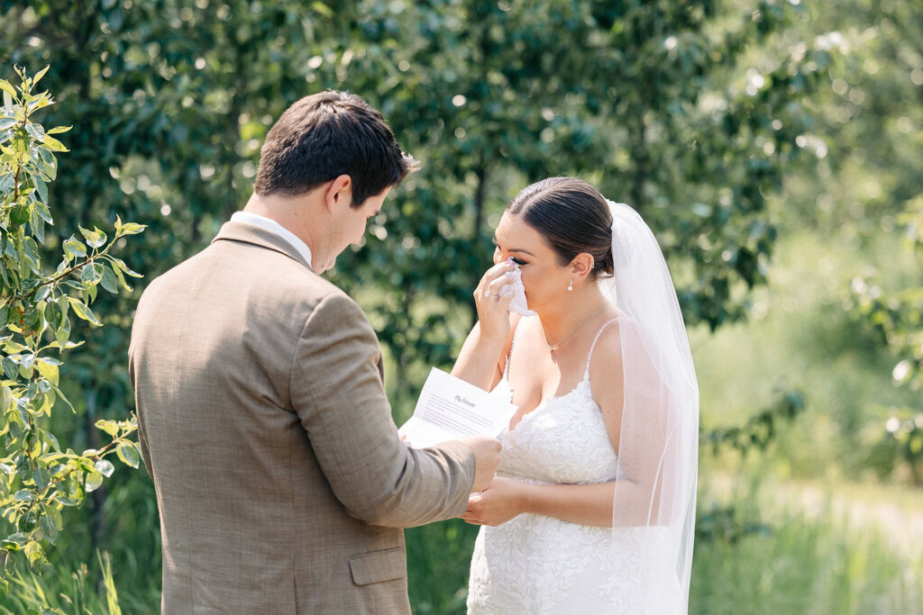 Bride and groom exchange vows during heartfelt ceremony captured by Lorissa Lee Photography. Featured on Brontë Bride.