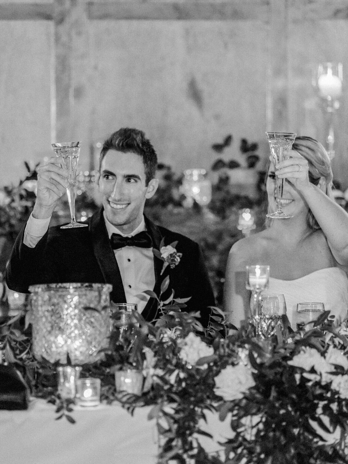 Newlyweds toast to their marriage during their Cafe Brauer reception