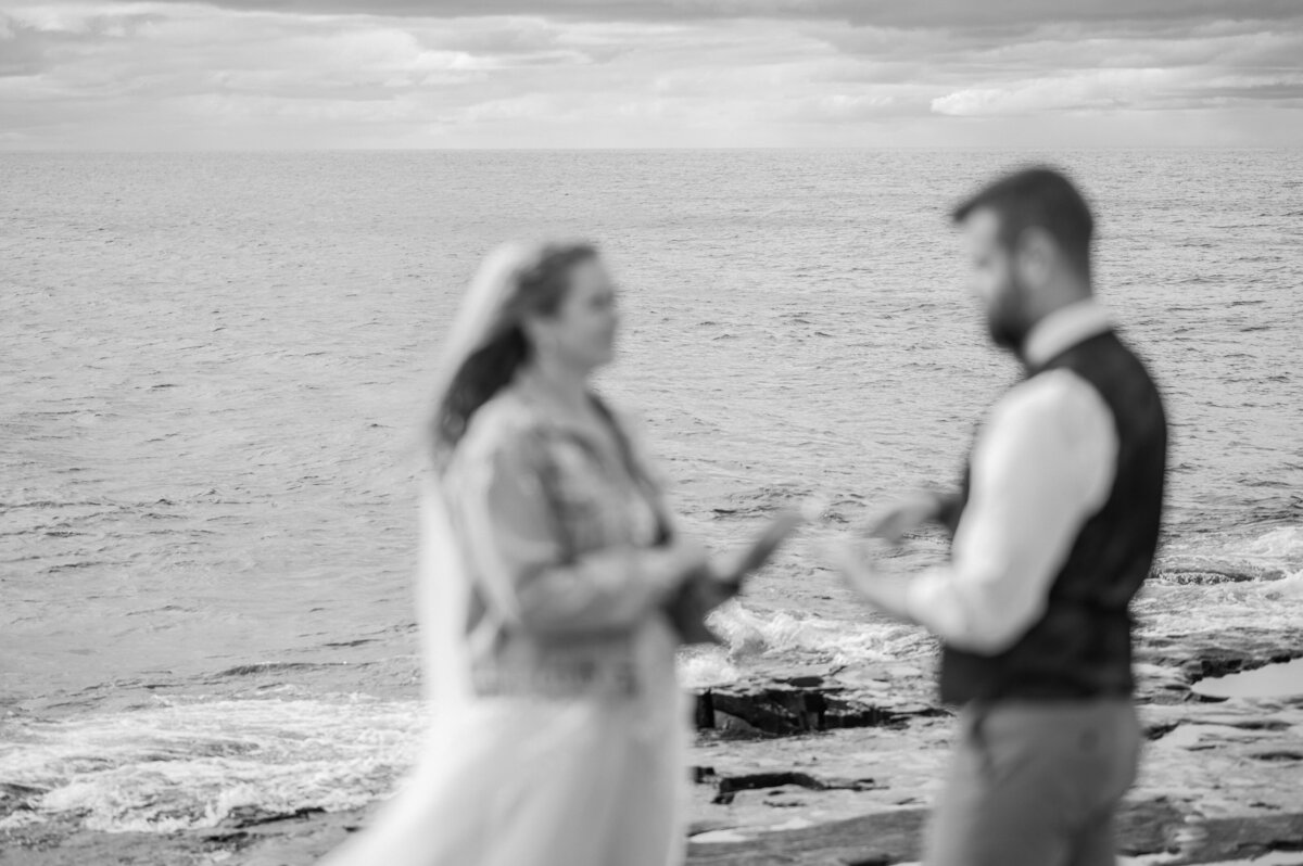 the couple exchange the vows by lake Superior