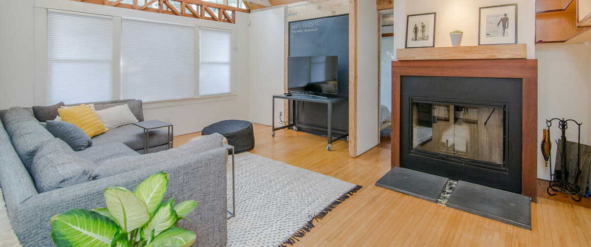 Photo of an Atlanta Georgia house's living room, showing the couch and fireplace