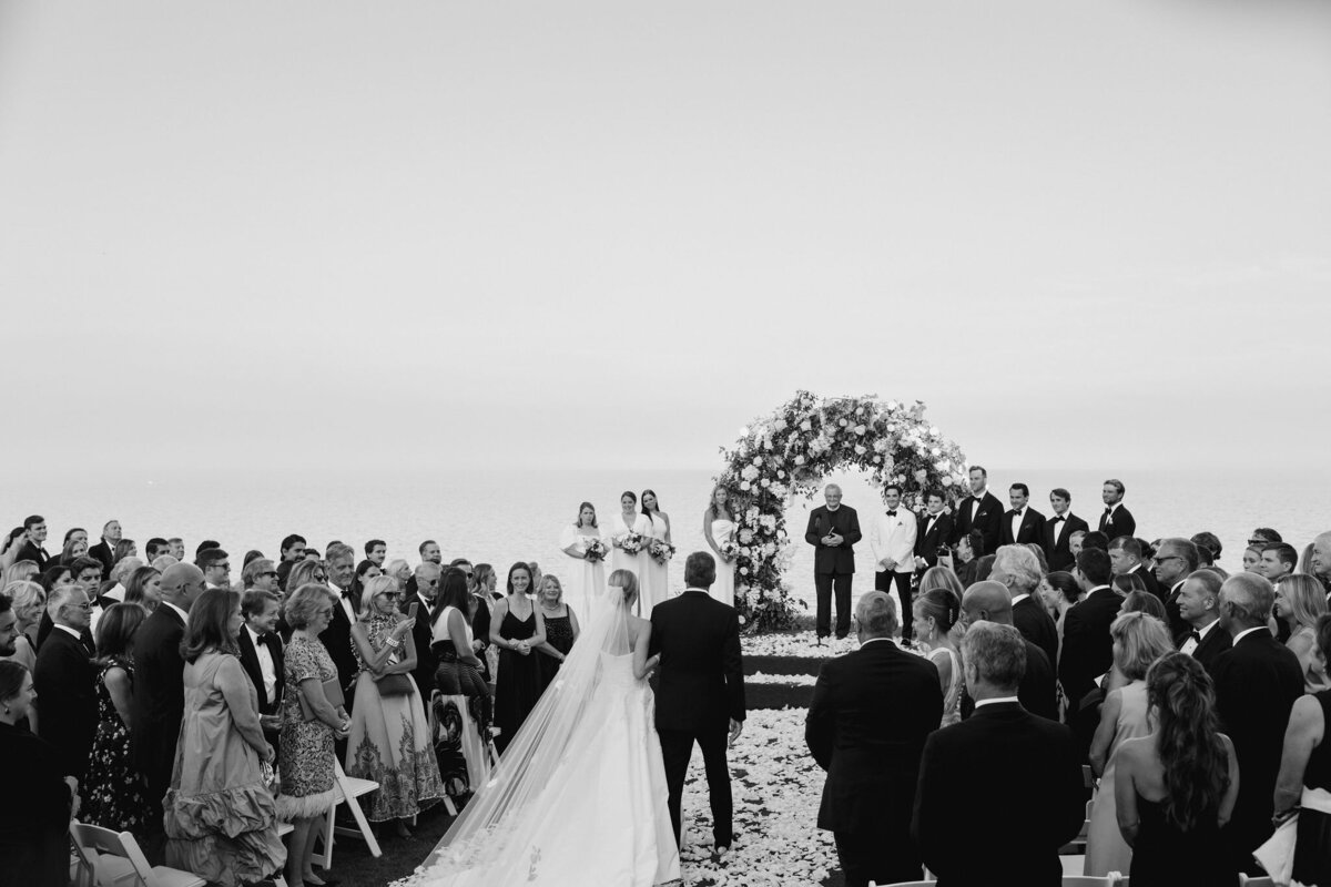 The bride walking down the aisle at the Shoresacres CC. 