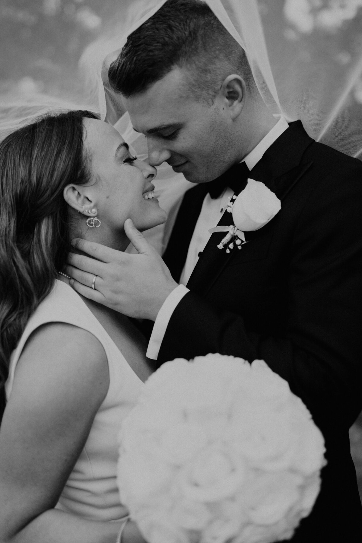 Black and White Photo of Bride and Groom Kissing in New York City Wedding