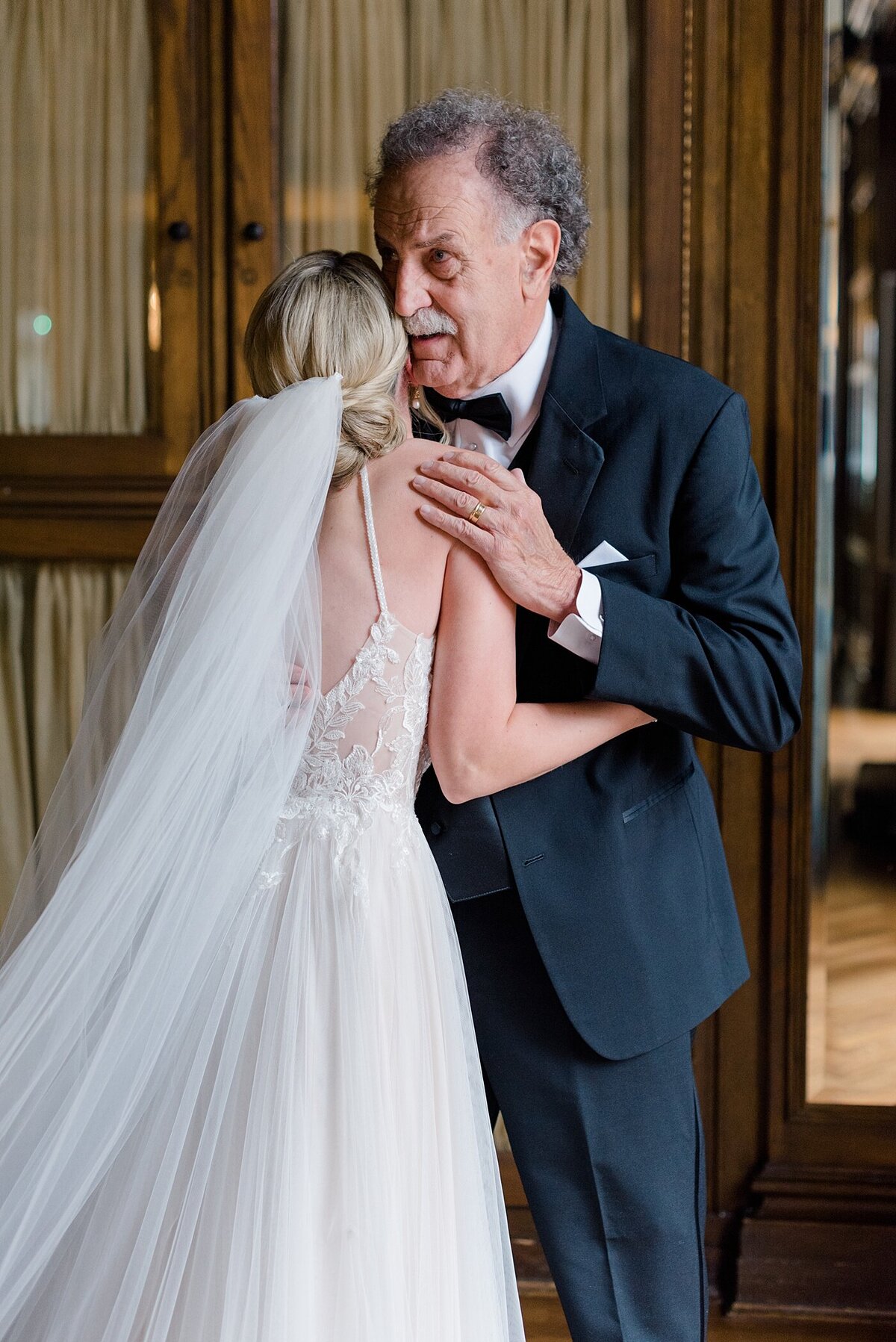 Dad hugs bride at first look photographed by Ohio Wedding Photographer