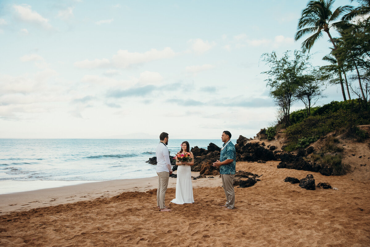 Maui Wedding Photographer captures intimate wedding ceremony with couple on beach