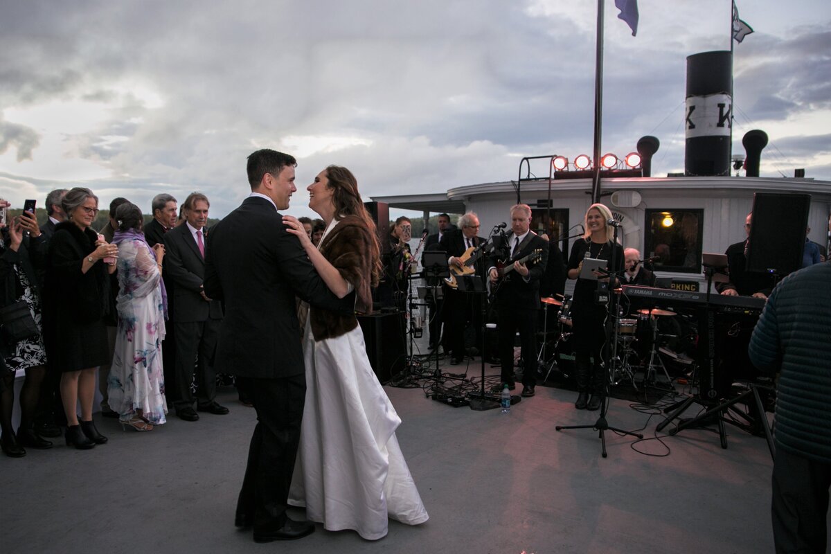 Bride and Groom dancing together at reception on boat | Taken by Maine Photographer
