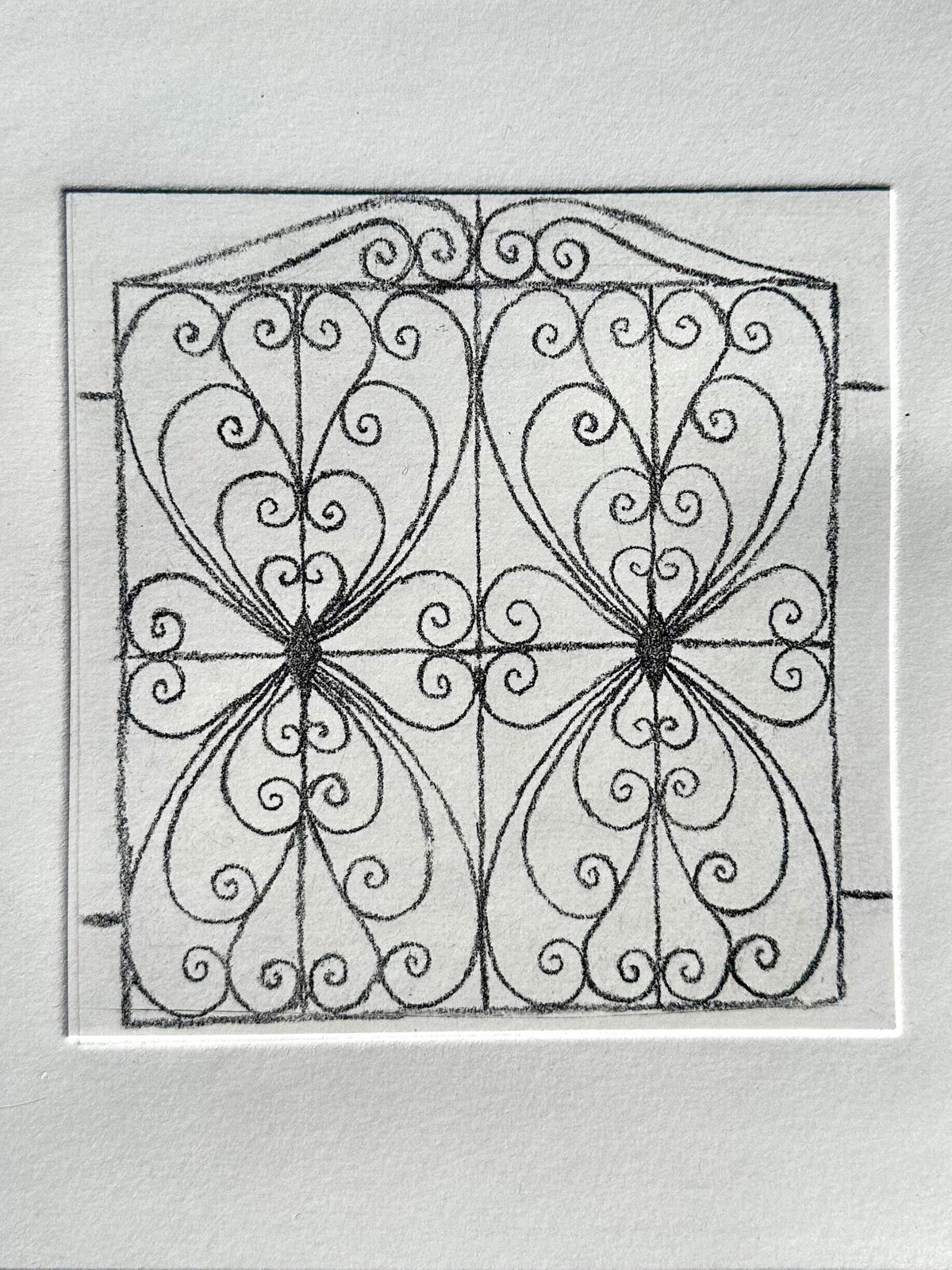 A finished black-on-white print featuring mirrored heart and scroll linework from the line reversal technique.