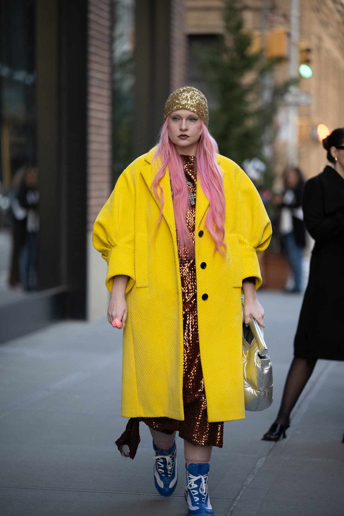 fashion week guest in yellow coat