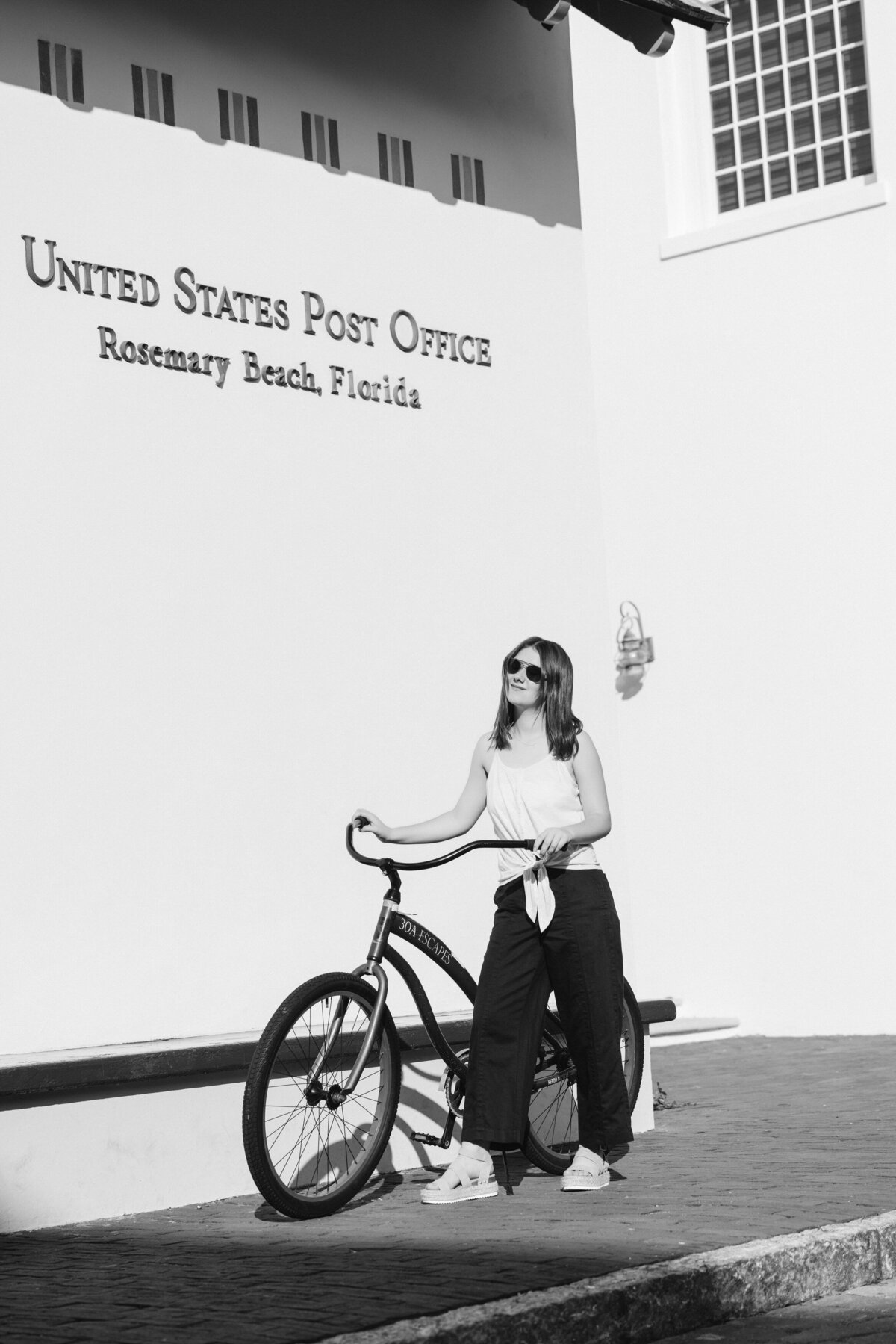 A girl walking with a bike