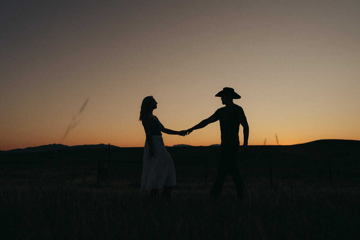 Couple during golden hour engagement shoot in  Idaho wedding/elopement - photographed by The Storytellers